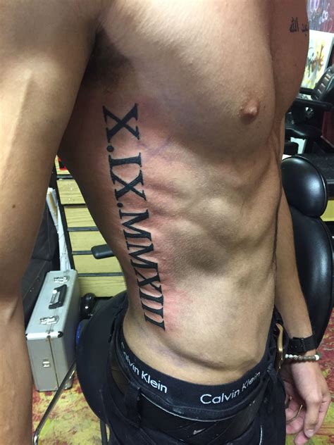 roman numerals rib tattoo